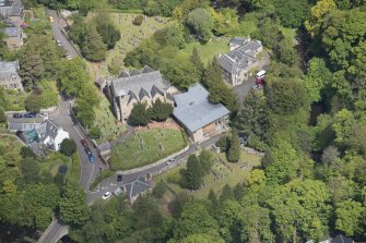 Oblique aerial view of Colinton Parish Church, burial ground and Colinton Manse, looking N.