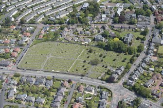 Oblique aerial view of Liberton Parish Church and Liberton Cemetery, looking NE.