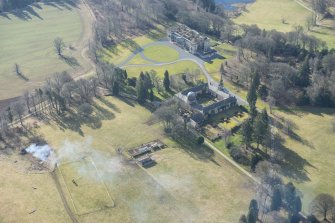 Oblique aerial view of the Penicuik House and stables, looking S.