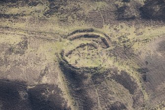 Oblique aerial view of the settlement and track, looking ESE.