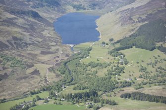 General oblique aerial view of Lochlee with Invermark Castle in the foreground, looking WSW.