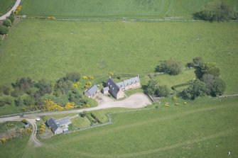 Oblique aerial view of Easter Clune House and Castle of Easter Clune, looking N.