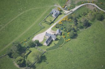 Oblique aerial view of Easter Clune House and Castle of Easter Clune, looking SW.