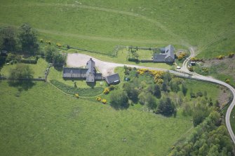 Oblique aerial view of Easter Clune House and Castle of Easter Clune, looking SSE.