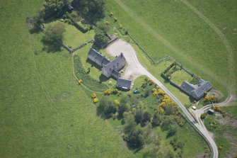 Oblique aerial view of Easter Clune House and Castle of Easter Clune, looking ESE.