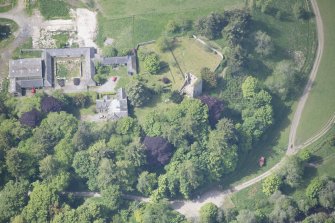 Oblique aerial view of Drumin Castle and Drumin Farmstead, looking W.