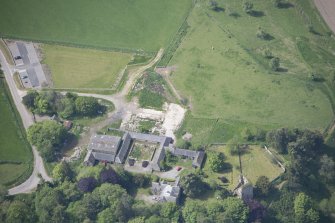 Oblique aerial view of Drumin Castle and Drumin Farmstead, looking WSW.