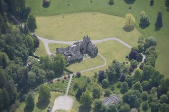 Oblique aerial view of Ballindalloch Castle, looking SSE.