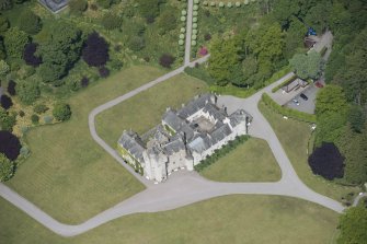 Oblique aerial view of Ballindalloch Castle, looking NW.