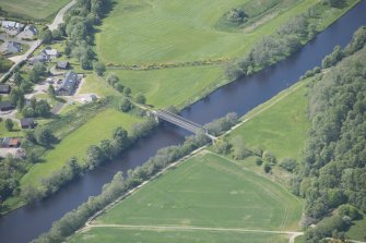 Oblique aerial view of Ballindalloch railway bridge, looking SW.