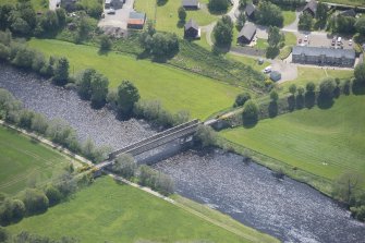 Oblique aerial view of Ballindalloch railway bridge, looking SE.