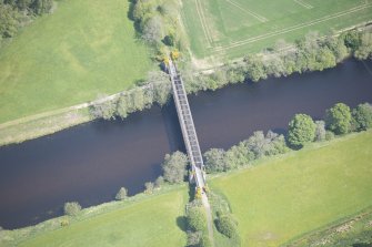 Oblique aerial view of Ballindalloch railway bridge, looking NE.