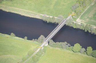 Oblique aerial view of Ballindalloch railway bridge, looking N.