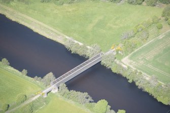 Oblique aerial view of Ballindalloch railway bridge, looking NNW.