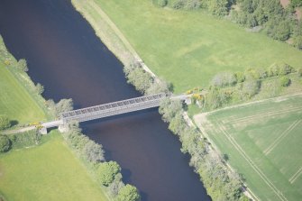 Oblique aerial view of Ballindalloch railway bridge, looking NW.