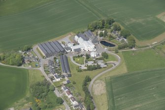 Oblique aerial view of Cardhu Distillery, looking NW.