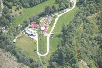 Oblique aerial view of Knockando Woollen Mill, looking ESE.