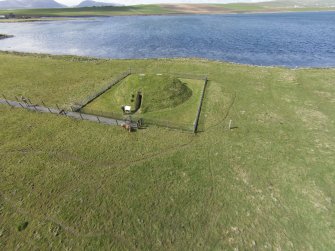 Oblique aerial view of Unstan chambered cairn, looking W.