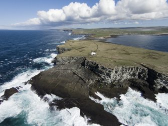 Oblique aerial view of the lighthouse at Brough of Birsay, looking ENE.