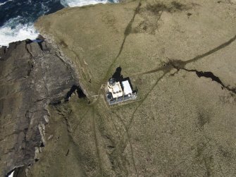 Oblique aerial view of the lighthouse at Brough of Birsay, looking NE.