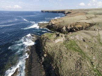 Oblique aerial view of the Broch of Borwick, Yesnaby, looking NE.