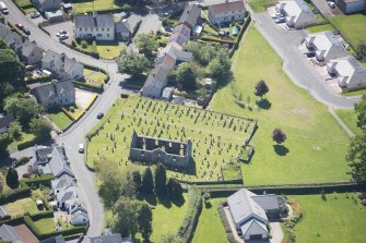 Oblique aerial view of Killearn Old Parish Church and graveyard, looking SE.