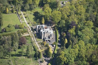 Oblique aerial view of Auchenibert Country House, looking NE.