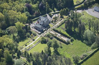Oblique aerial view of Auchenibert Country House, looking SE.