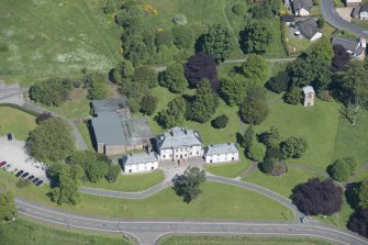 Oblique aerial view of the Strathleven House and dovecot, looking N.