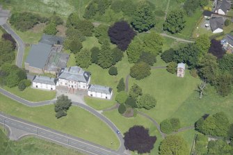 Oblique aerial view of the Strathleven House and dovecot, looking NW.