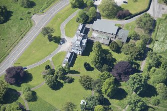 Oblique aerial view of the Strathleven House and dovecot, looking SW.