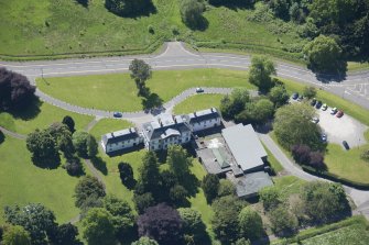 Oblique aerial view of the Strathleven House and dovecot, looking S.