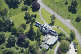 Oblique aerial view of the Strathleven House and dovecot, looking SE.
