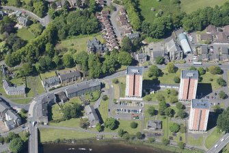 Oblique aerial view of Levenford House, Lomond Court. Bridgend Church and Church Hall, looking W.