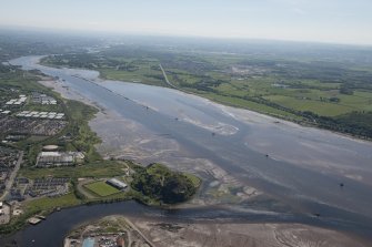 General oblique aerial view of the River Clyde centred on the Lang Dyke sea defences with Dumbarton FC and Dumbarton Castle in the foreground, looking SE.