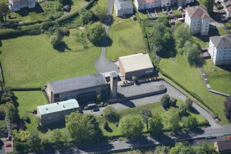 Oblique aerial view of the Holy Family Roman Catholic Church, looking SSW.