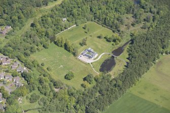 Oblique aerial view of Dougalston Factor's House, looking NE.