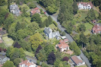 Oblique aerial view of Windyhill House, looking NNE.