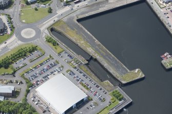 Oblique aerial view of Cartsburn Shipyard Dry Dock, looking WSW.