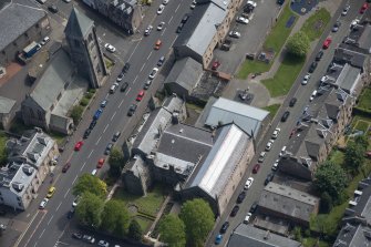 Oblique aerial view of St John The Evangelist Episcopal Church and Greenock Art Gallery and Library, looking SE.