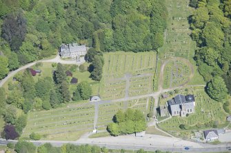 Oblique aerial view of Kilmun Cemetery, St Munn's Church, Collegiate Church of St Mun, Old Kilmun House and St Munn's Church and Churchyard, looking NNE.