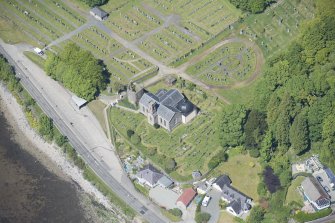 Oblique aerial view of Kilmun Cemetery, St Munn's Church, and Collegiate Church of St Mun, looking NW.