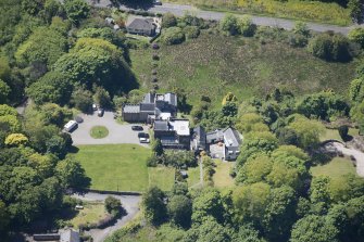 Oblique aerial view of Craigrownie Castle, looking SW.
