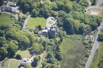 Oblique aerial view of Craigrownie Castle, looking SSE.