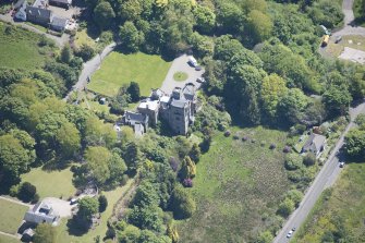 Oblique aerial view of Craigrownie Castle, looking SE.