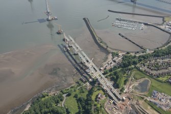 Oblique aerial view of the construction of the Queensferry Crossing and Port Edgar, looking NE.