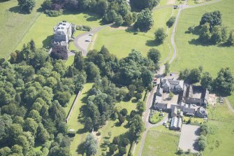 Oblique aerial view of Newliston House, stables and coach house, looking ENE.