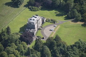 Oblique aerial view of Newliston House, looking NE.