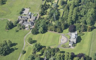 Oblique aerial view of Newliston House, stables and coach house, looking SW.