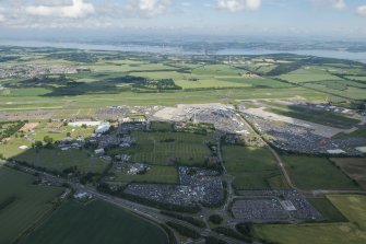 Oblique aerial view of Edinburgh Airport and Ingliston, looking NNW.